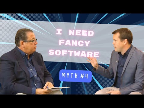 Two men in a business interview setting debunking Myth #4: I Need Fancy Software to build business systems