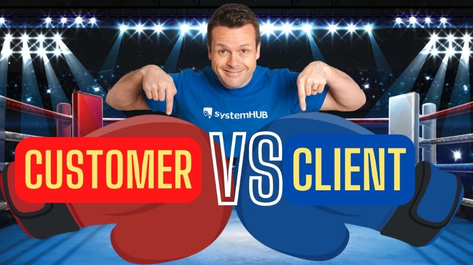 David Jenyns in SystemHUB shirt pointing at boxing gloves labelled Customer vs Client in a boxing ring